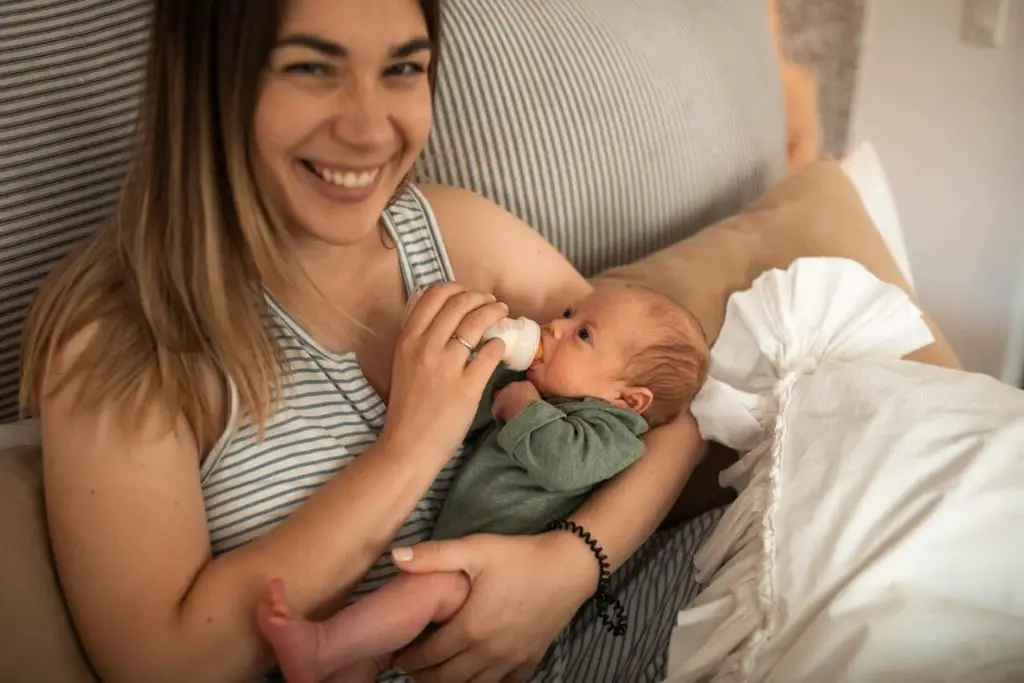 Mother Holding Her Newborn Baby Son