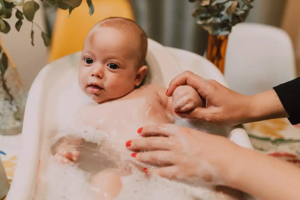 Mum Bathing a Newborn in the Sink